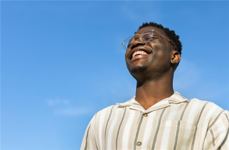 guy smiling at the sky